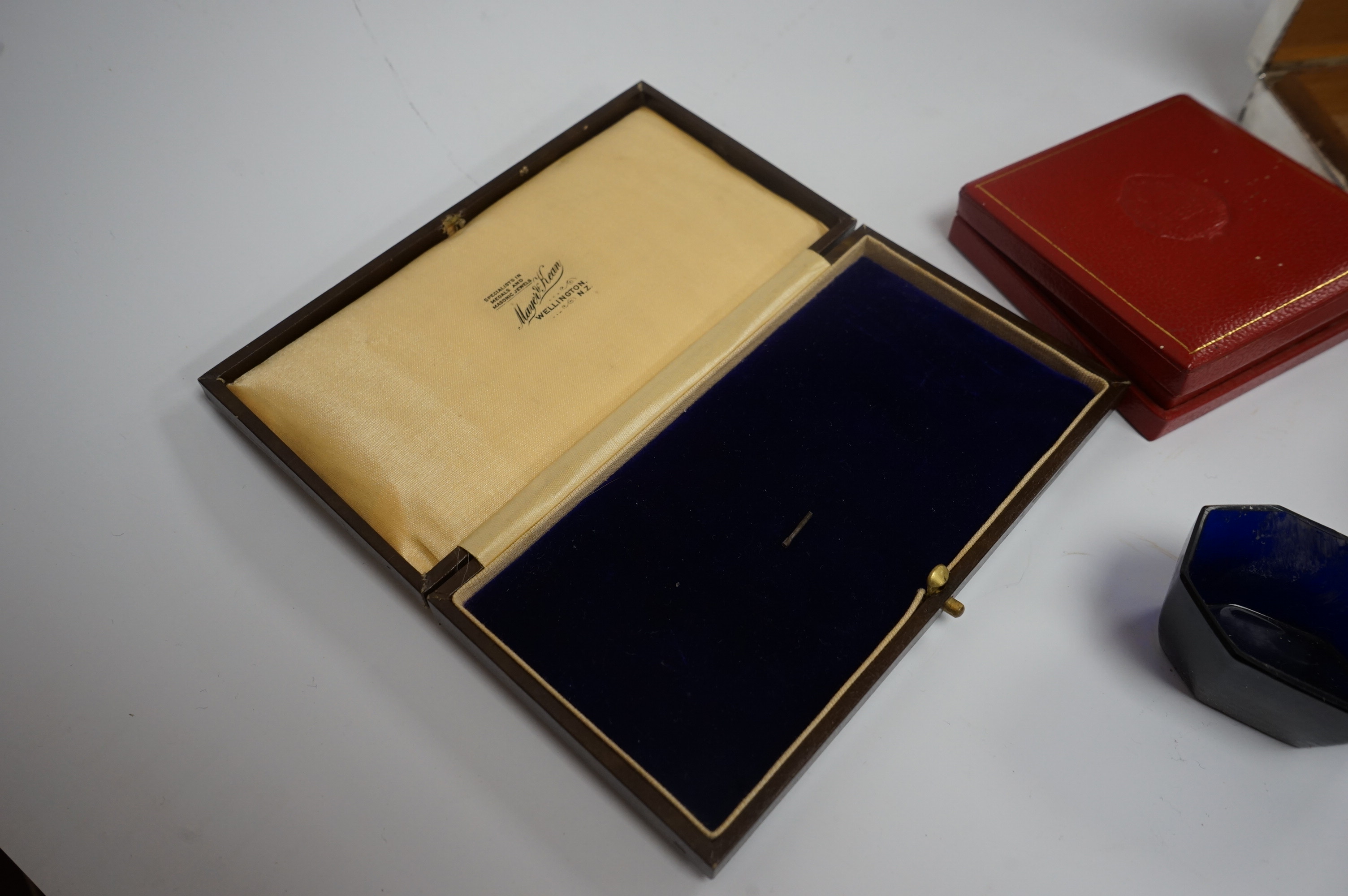 A pair of late George II silver bun salts, David Mowden, London 1759, with blue glass liners, a 1950's silver mounted cigarette box, 11.5cm and seven other items including condiment spoons and a cased Romanian medallion.